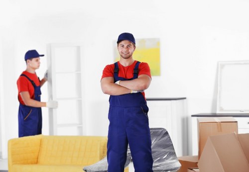 Trained man and van staff using PPE during a Kensington property move