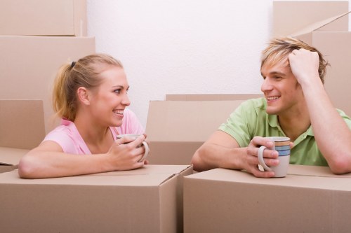 Removal team planning a flat move in Kensington with boxes and furniture