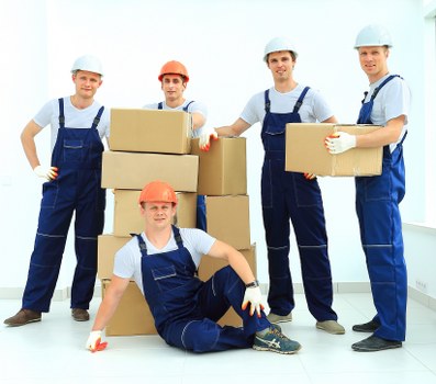 Professional moving help handling items in a Kensington property
