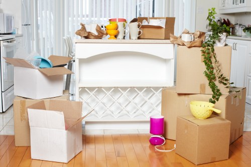 Local movers packing fragile items in Kensington