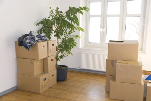 Prepared moving boxes and household items ready for a Kensington flat relocation