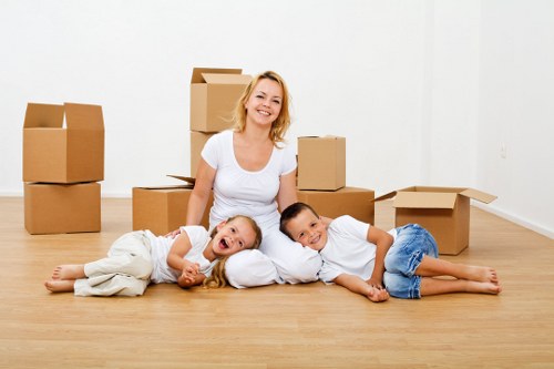 Loading furniture into a van as part of a moving service