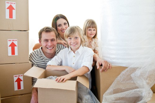 Boxes and wrapped furniture ready for a residential move in Kensington