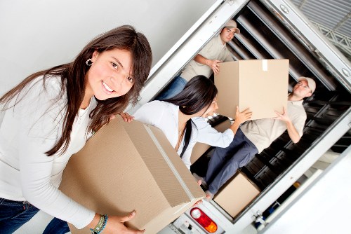 Careful loading of household items into a removal van